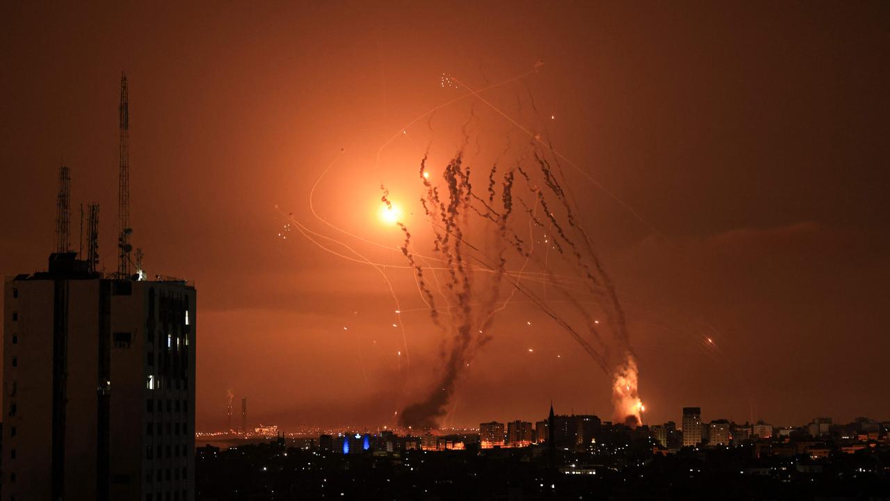 A salvo of rockets is fired by Palestinian militants from Gaza. (Photo by MAHMUD HAMS / AFP)