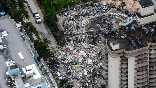 This aerial view, shows search and rescue personnel working on site after the partial collapse of the Champlain Towers South in Surfside, north of Miami Beach.