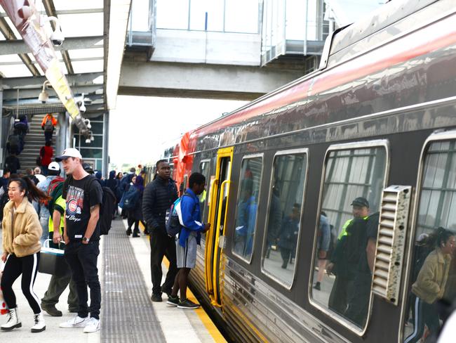 Passengers board a train at Mawson Lakes train station, May 14, 2020. (Pic: Brenton Edwards)