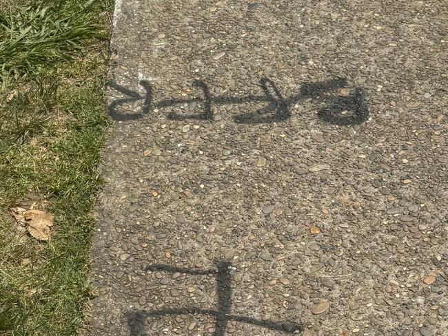 NAZI swastika seen on a footpath on Elaine Ave in Avalon Beach