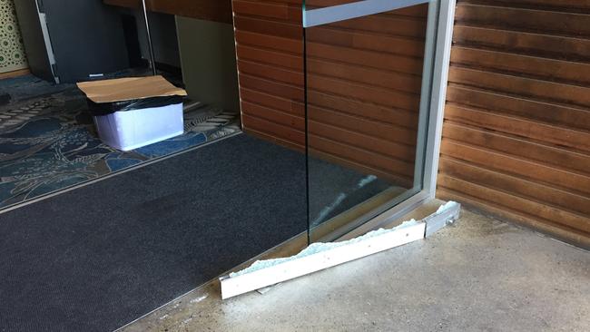 Bandits allegedly used a gun to shoot through a glass door to get inside the Norfolk Tavern at Ormeau on the Gold Coast.