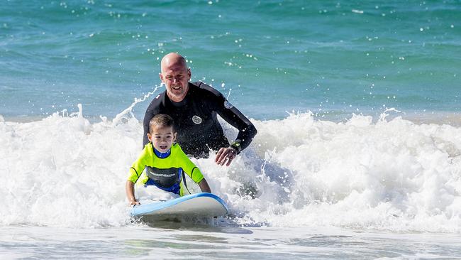 Kai Long, 5, gives surfing a go. Picture: Jerad Williams