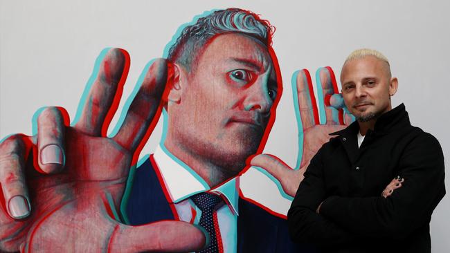 Packing Room Prize Winner Claus Stangl poses alongside his portrait titled 'Taika Waititi' during the 2022 Packing Room Prize announcement on May 05, 2022 in Sydney, Australia. The Packing Room prize is selected by the art packers receiving entries for the Archibald prize. Photo by Don Arnold/WireImage