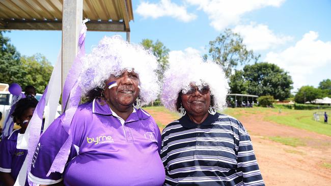 Tikilaru Dockers supporters Anne Marrie Puruntataneri and Ancilla Kurrupuwu pose for a photo at the Tiwi Grand Finals. Picture: Keri Megelus