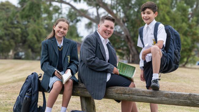 St John's Regional College students, Holly Egan, Flynn Hyland and Daniel Hainagiu are starting year 7 this year. Dressed in their uniform with their school bags. All are excited to be going to school soon. Picture: Tony Gough