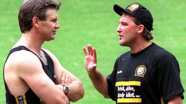 Danny Frawley gets some advice from friend Doug Hawkins during his time as Richmond coach.