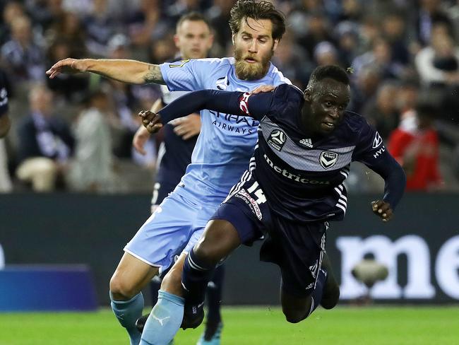 Melbourne City’s Joshua Brillante fouls Melbourne Victory’s Thomas Deng. Picture: AAP