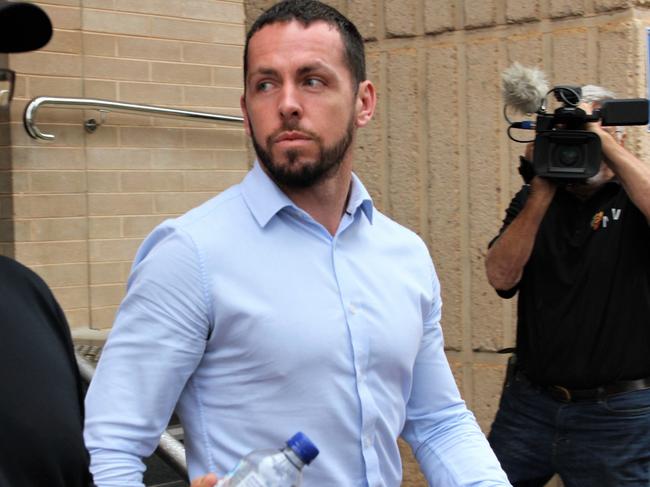 Zach Rolfe leaves the Alice Springs Local Court in November after invoking a ‘penalty privilege’ and being excused from giving further evidence. Picture: Jason Walls