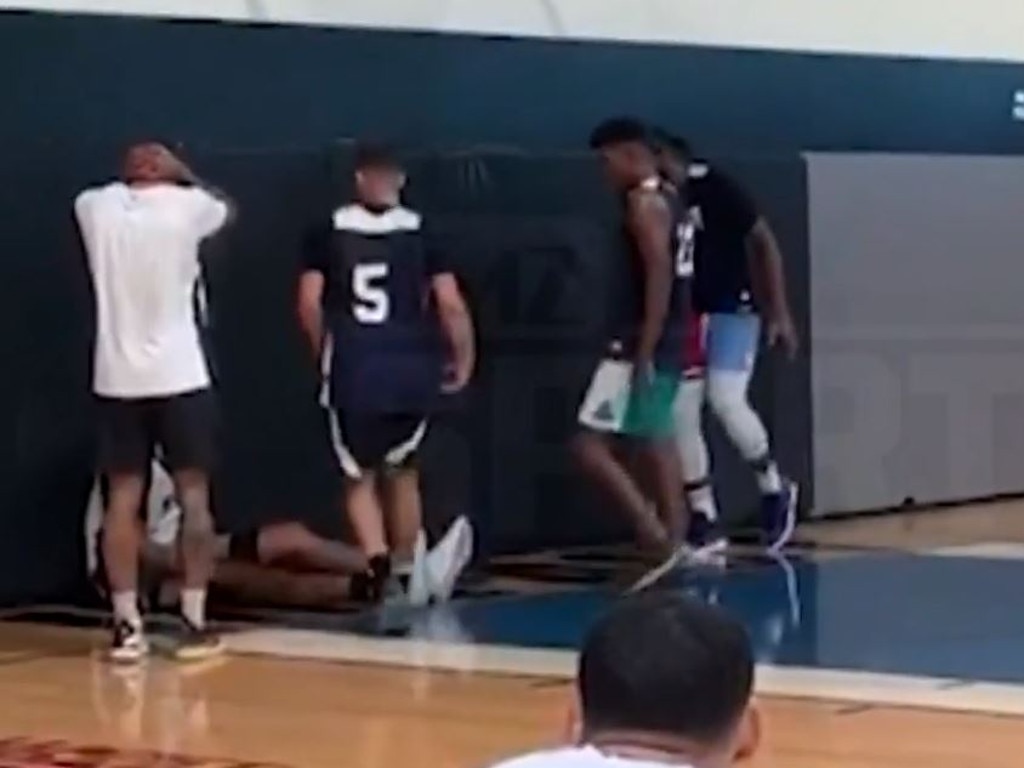 DeMarcus Cousins falls to the floor in practice.