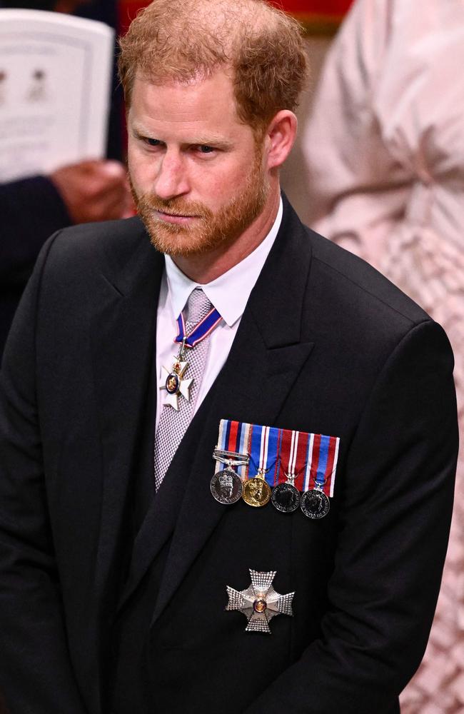 Prince Harry was thousands away from his wife on kids during the most momentous royal occasion in 70 years. Picture: Gareth Cattermole / POOL / AFP