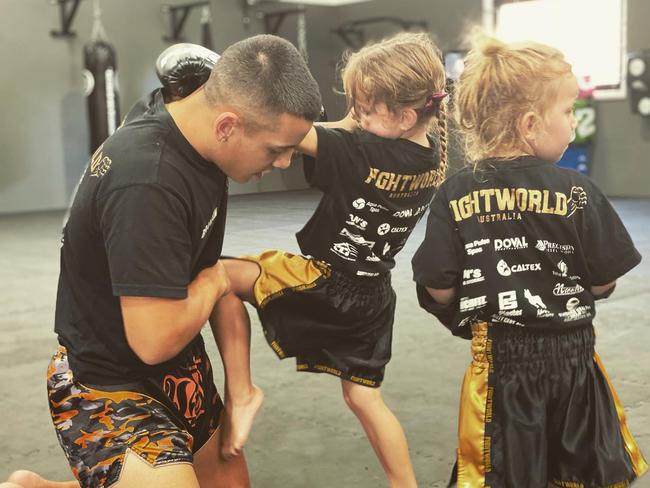 Fight World coach Brandon Baresic teaches the younger fighters techniques on how to throw the perfect leg kick. Picture: Supplied