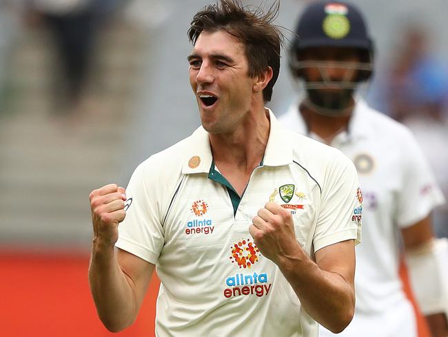 MELBOURNE, AUSTRALIA - DECEMBER 27: Pat Cummins of Australia celebrates taking the wicket of Cheteshwar Pujara of India during day two of the Second Test match between Australia and India at Melbourne Cricket Ground on December 27, 2020 in Melbourne, Australia. (Photo by Robert Cianflone/Getty Images)