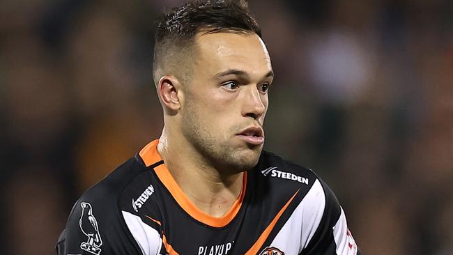 Luke Brooks of the Wests Tigers runs the ball during the round 14 NRL match between Wests Tigers and Canberra Raiders at Campbelltown Stadium on June 02, 2023 in Sydney, Australia. (Photo by Cameron Spencer/Getty Images)