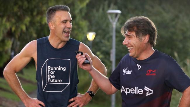 Peter Malinauskas is interviewed by Advertiser journalist Paul Starick after a brisk dawn run. Picture: Dean Martin