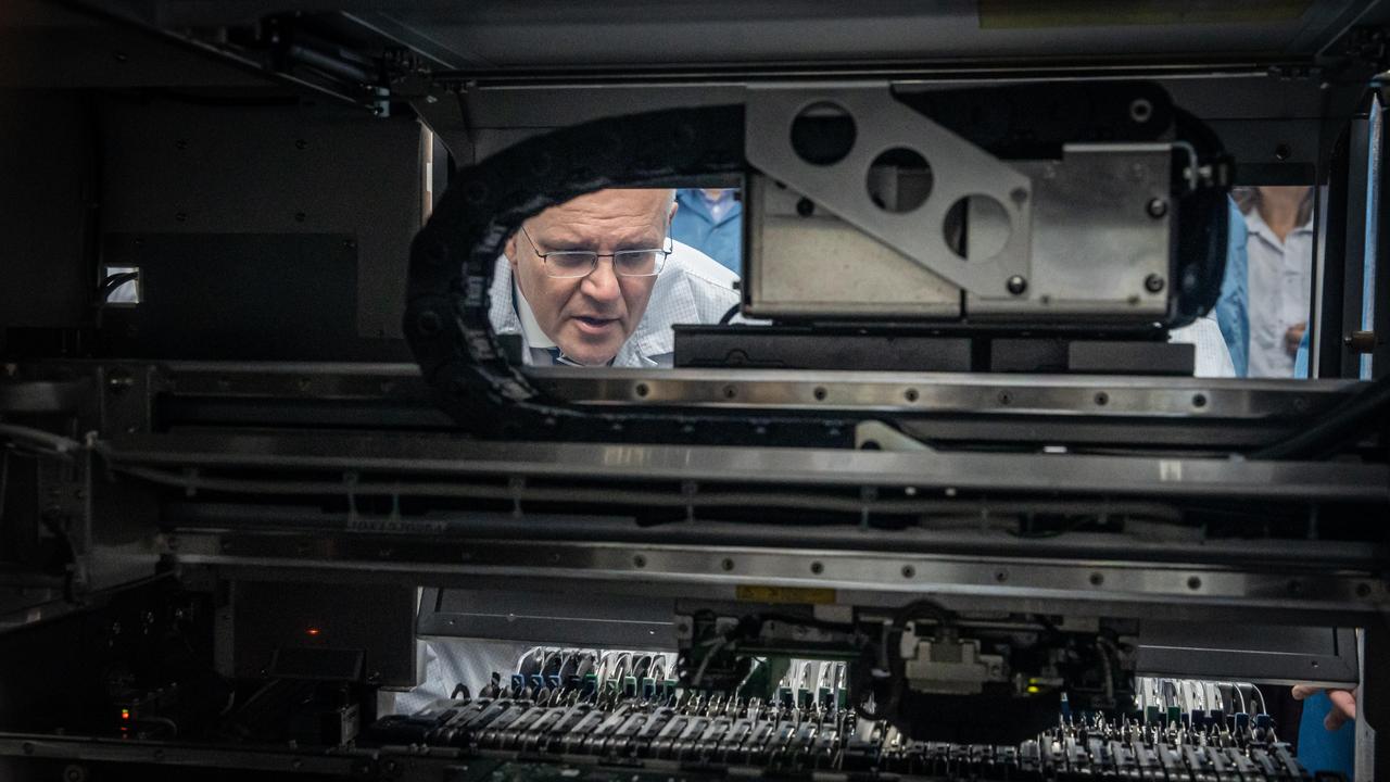 Scott Morrison joins Gladys Liu MP for a tour of Extel Technologies, a modern manufacturing business specialising in the design and production of microchips and computer board in Melbourne on Friday. Picture: Jason Edwards