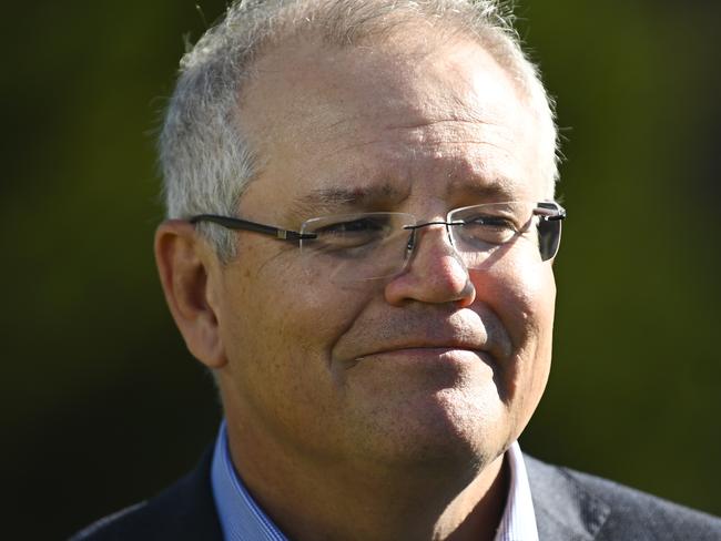 Australian Prime Minister Scott Morrison speaks to the media during a visit to Robyn Rowe Chocolates with the Liberal candidate for the seat of Eden-Monaro Fiona Kotvojs in Murrumbateman near Canberra, Sunday, May 24, 2020. (AAP Image/Lukas Coch) NO ARCHIVING