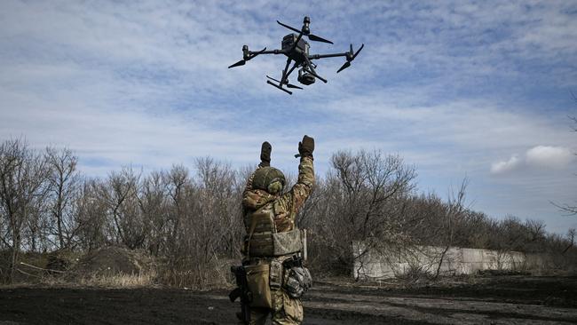 A Ukrainian serviceman flies a drone to spot Russian positions near the city of Bakhmut. Picture: AFP