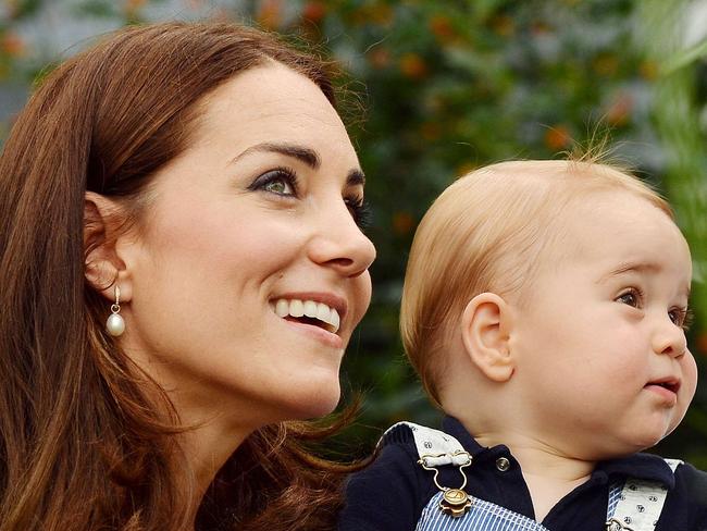 TO GO WITH AFP STORY BY JAMES PHEBY (FILES) In a file picture taken in London on Wednesday July 2, 2014, to mark Britain's Prince George's first birthday, shows Prince William (L) and Catherine, Duchess of Cambridge with Prince George during a visit to the Sensational Butterflies exhibition at the Natural History Museum in London. The birth of Prince William and his wife Kate's second baby will cap a momentous four years for Britain's golden couple, completing their journey from student sweethearts to regal domesticity. From the moment William drove his new family home from hospital after the birth of Prince George in 2013, his hands-on approach has been in stark contrast to previous generations of royal fathers. AFP PHOTO / JOHN STILLWELL / POOL EDITORIAL USE ONLY