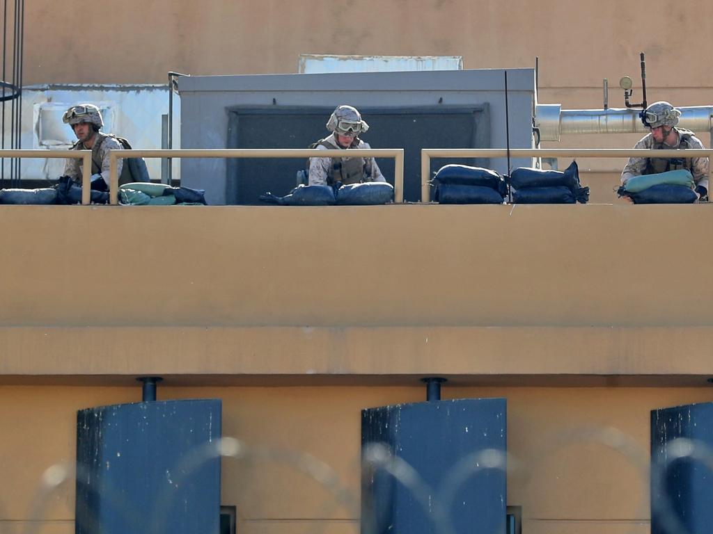 US soldiers prepare defensive position on the roof of the US embassy in Baghdad, Iraq. Picture: AP