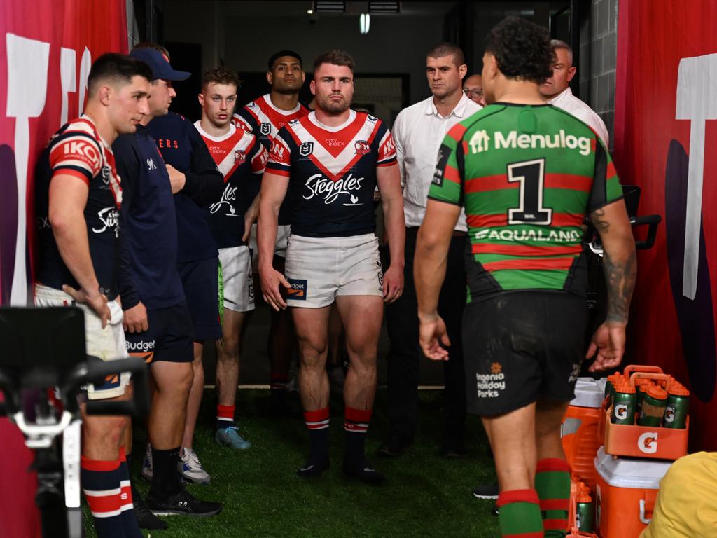 Latrell Mitchell (R) walks into a frosty reception.