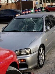 The smashed windscreen of the nightclub worker's car.