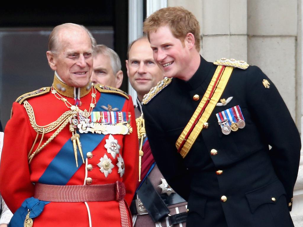 Prince Harry and Prince Philip, Duke of Edinburgh share a joke on the balcony during Trooping the Colour – Queen Elizabeth II's Birthday Parade, at The Royal Horseguards on June 14, 2014 in London, England. Picture: Chris Jackson/Getty Images)