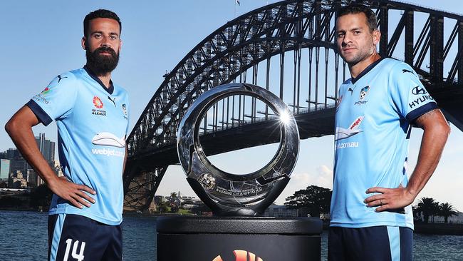 Alex Brosque and Bobo with the Hyundai A-League trophy. Picture: Brett Costello