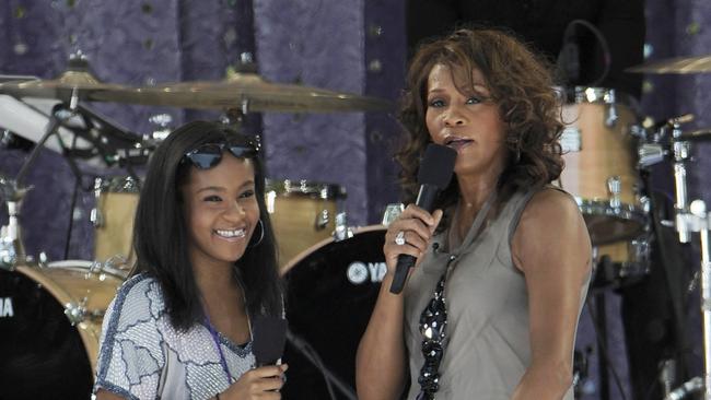 The late Whitney Houston with daughter Bobbi Kristina Brown perform on Good Morning America in 2009.