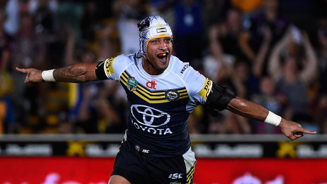 Thurston of the Cowboys celebrates after kicking the winning field goal during the round four NRL match between the North Queensland Cowboys and the Melbourne Storm at 1300SMILES Stadium on March 30, 2015 in Townsville.