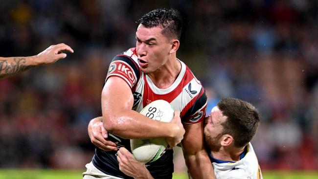 BRISBANE, AUSTRALIA - MAY 15: Joseph Manu of the Roosters takes on the defence during the round 10 NRL match between the Sydney Roosters and the Parramatta Eels at Suncorp Stadium, on May 15, 2022, in Brisbane, Australia. (Photo by Bradley Kanaris/Getty Images)