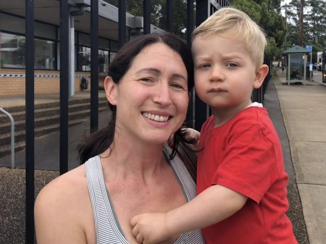 Lauren Waite, with toddler son Joel, of Allambie Heights, outside Allambie Heights Public School on Friday.