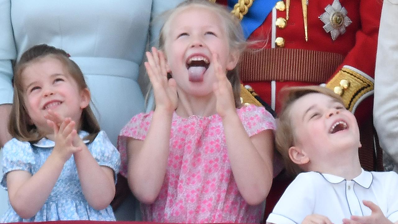 Princess Charlotte, Savannah Phillips and Prince George share a giggle at Buckingham Palace. Picture: Mega