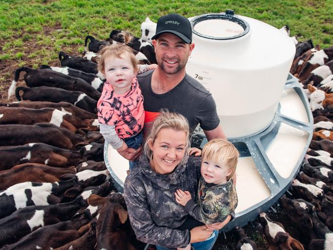 Nicole and Brendan Saunders on their Maffra dairy farm with their children Jaxson, 2, and Kara, 1. The employee in one of the pictures with Nicole is Jasper Manuel. Pictures: Laura Ferguson