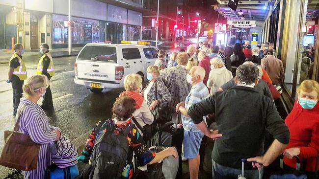 Norwegian Jewel passengers arrive at the Swissotel in Sydney CBD late last week for 14 days self isolation. Picture: Tom Huntley