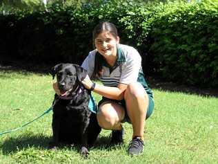 STUDENTS' BESTFRIEND: Lowood State High School student Sophie, with the school's beloved assistance dog, Jackson. Picture: Dominic Elsome