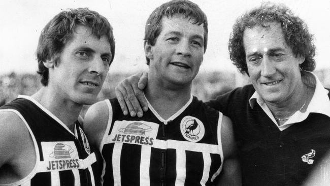 Port Adelaide’s Russell Ebert, David Granger and coach John Cahill after the Magpies’ 1981 SANFL grand final win over Glenelg at Football Park.