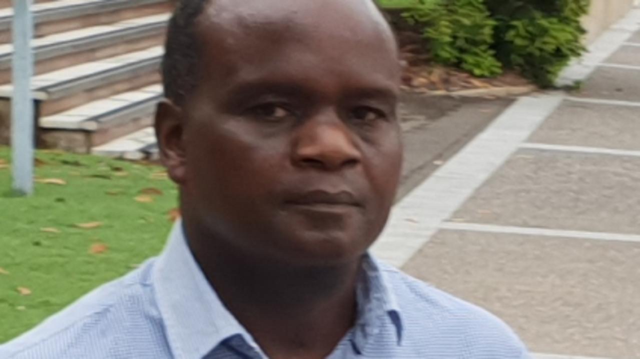 John Mugambi Mwamba  (right) as supported by Defence lawyer Mathai Joshi in his appearance at the Townsville Magistrates Court on Tuesday.  Photo: Leighton Smith