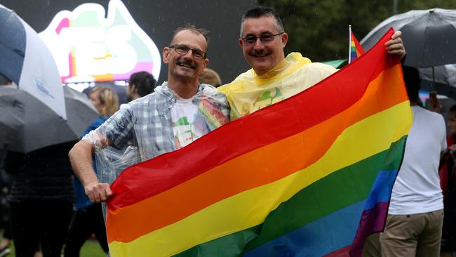 Ian Brett and Michael Collins celebrate the results. Picture: Kelly Barnes/The Australian