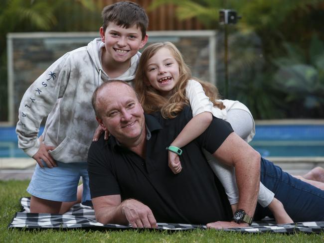 Ian Marr with kids Connor, 10, and Lily, 7, at home in Rouse Hill, today. Picture: Justin Lloyd.