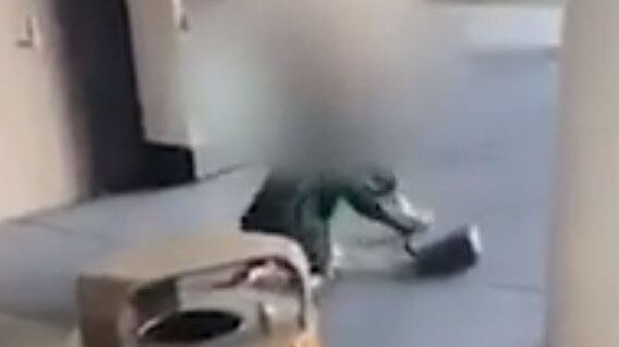 The victim is dragged to the ground before being punched repeatedly.