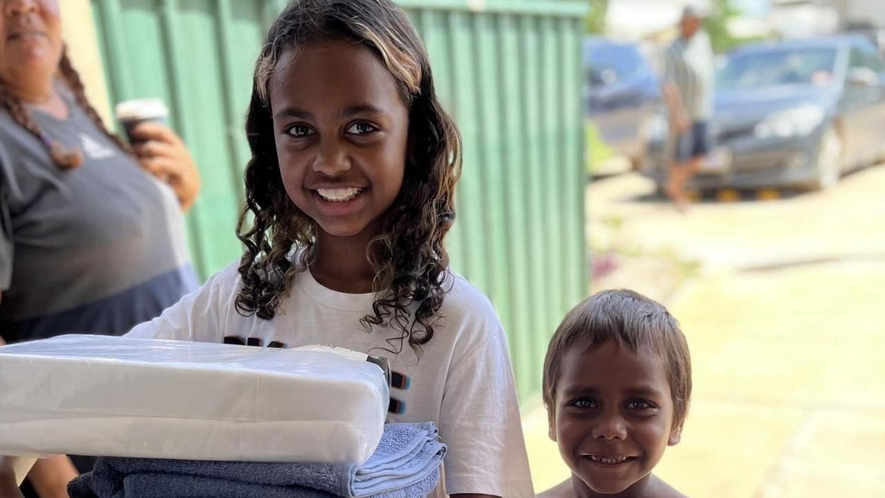 Fitzroy flood affected community members with donated critical non-food items, organised by the Foundation for Indigenous Sustainable Health (FISH) team. Picture: FISH.