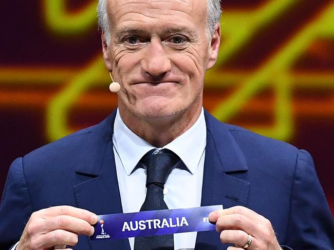 France's head coach Didier Deschamps shows the name of 