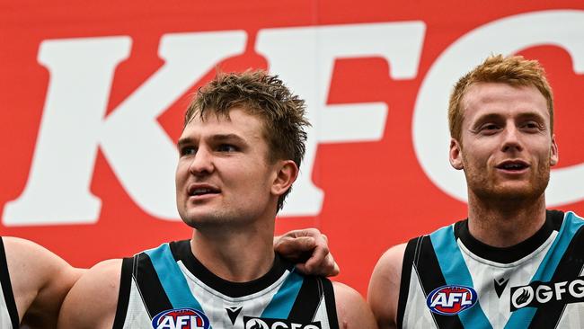 Ollie Wines (middle) midfield minutes have dipped this season. Picture: Daniel Carson/AFL Photos via Getty Images