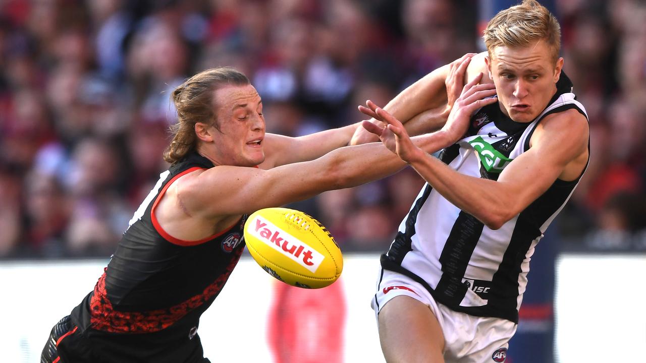 Mason Redman and Jaidyn Stephenson battle for a loose ball during last year’s Anzac Day clash. Picture: AAP Images