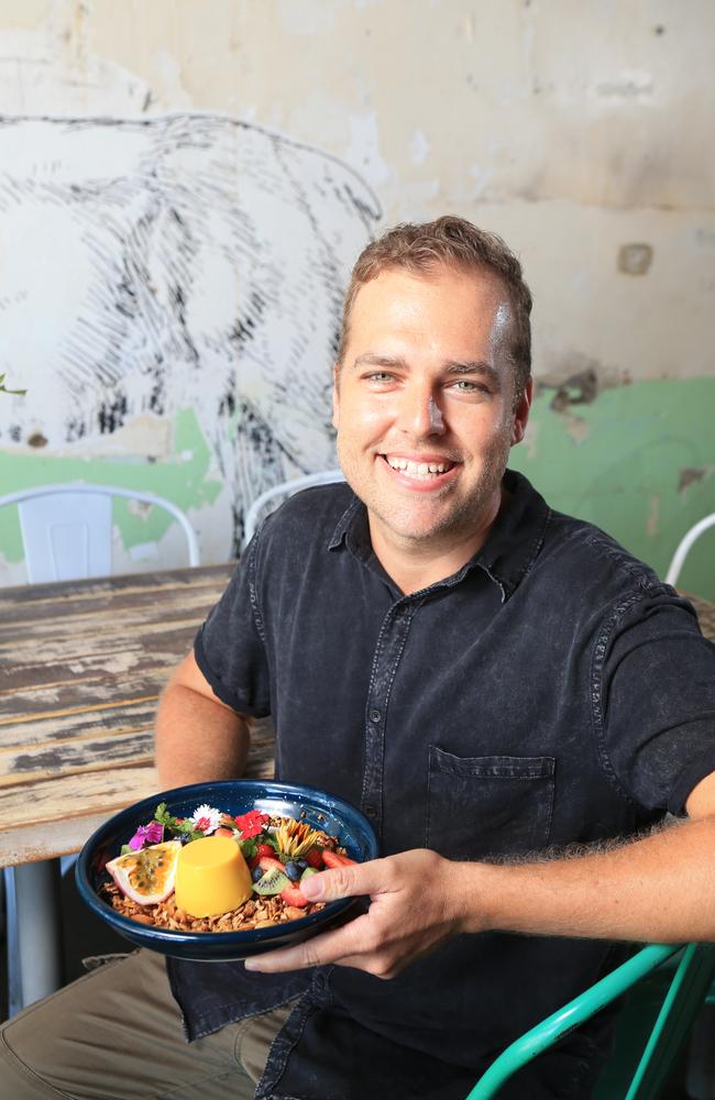 Andrew Whiting at Elk Espresso holding a plate of their passionfruit and coconut panna cotta. Pic Tim Marsden