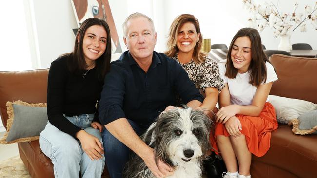 Mick Fuller, pictured with rescue dog Barney, has paid tribute to his wife Andrea and daughters Mia and Lara – as well as his two older children – for their support. Picture: Rohan Kelly