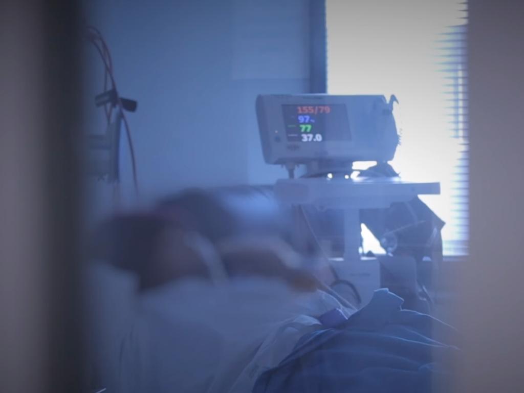 A Covid-19 patient at Liverpool Hospital struggles to breathe.