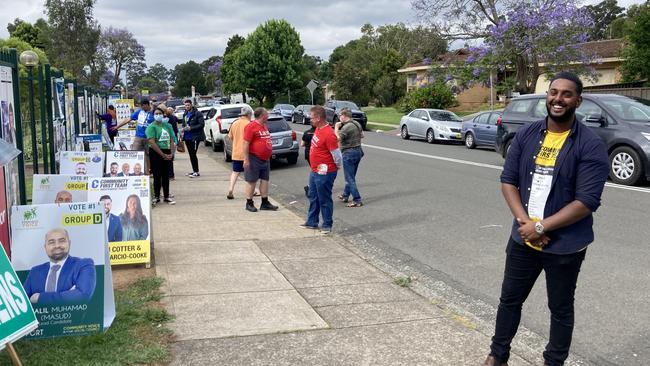 Busy scenes outside Bradbury public school in Campbelltown where the brother of council candidate Josh Cotter is helping out his brother.