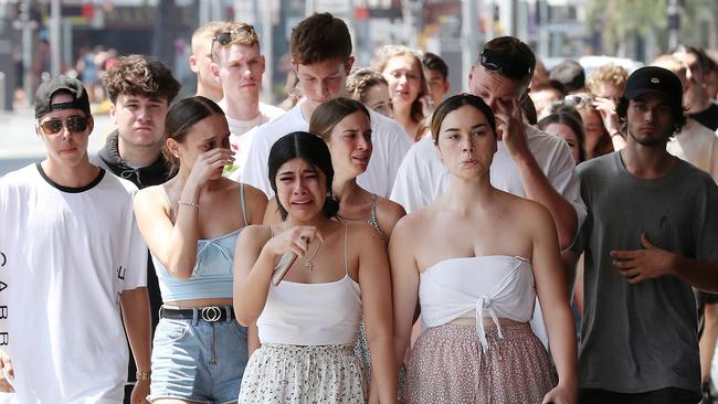 Friends of stabbing victim Jack Beasley gather to pay their respects at the scene of the tragedy outside the Surfers Paradise IGA. Picture: Liam Kidston.