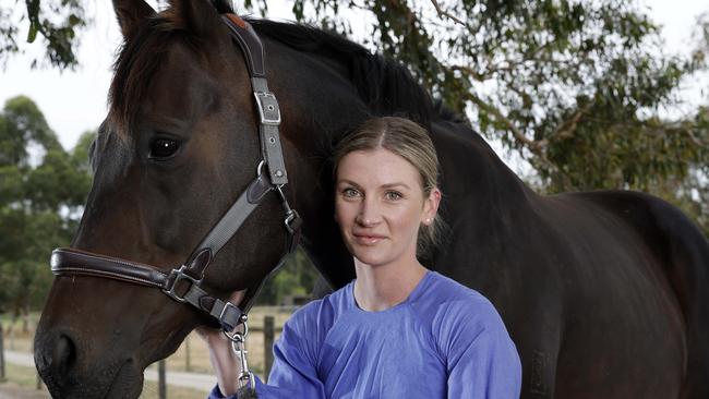 **WARNING WARNING - EMBARGO DO NOT USE UNTIL 10TH MARCH. CONTACT HERALDSUN PIC DESK FOR FURTHER INFO - WARNING WARNING** MELBOURNE , AUSTRALIA. March 3, 2024.  Champion jockey Jamie Kah with Brax her ex racehorse formerly known as Rich Rupee at her property in Somerville     . Pic: Michael Klein